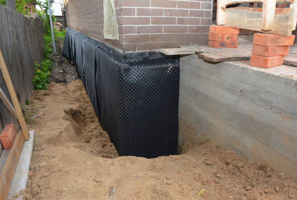Happy homeowners after waterproofing job in Ambler